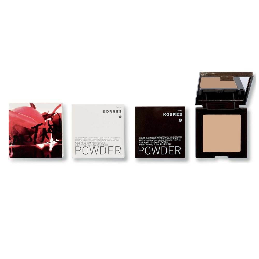 Poudre compacte ouverte avec miroir. Boîtier noir avec poudre beige. Emballages à côté.