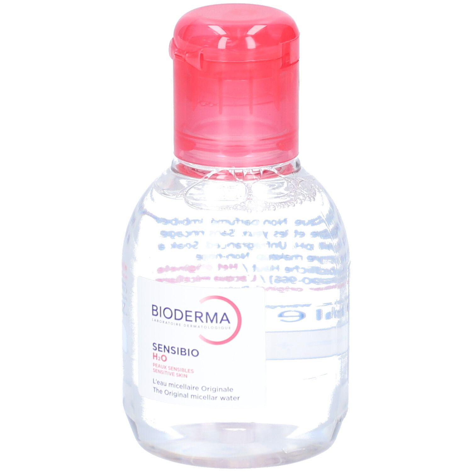 Kleine, transparente Flasche mit rotem Klappverschluss. Etikett mit BIODERMA und Sensibio H2O. Produkt für empfindliche Haut.