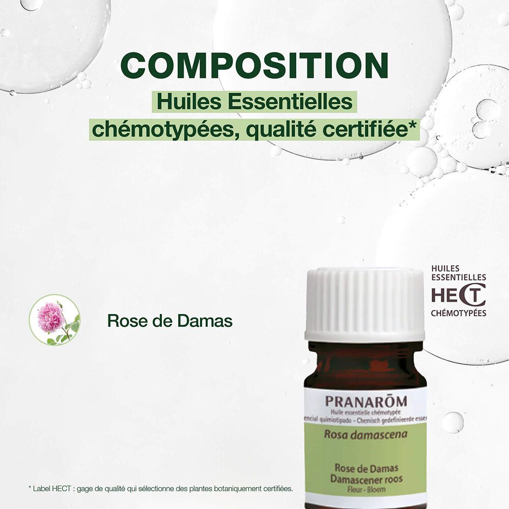 Braune Glasflasche mit weißem Verschluss. Aufschrift: Pranarom Rose de Damas. Hintergrund grün.