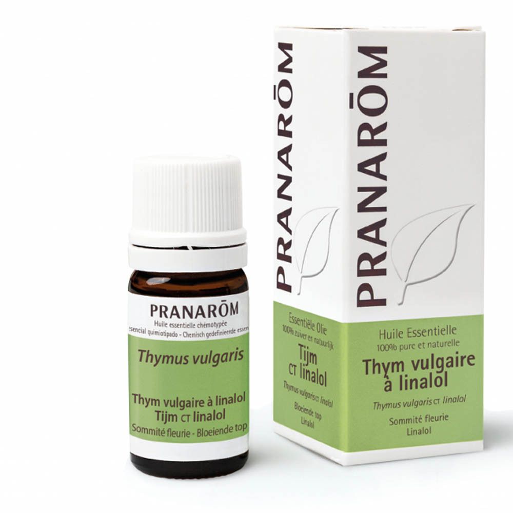 Flacon en verre brun et bouchon blanc, avec boîte. Inscriptions: PRANAROM, Thymus vulgaris, Thym ct linalol.