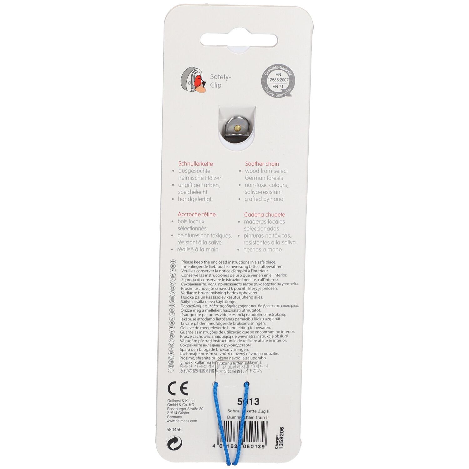 Rückseite der HEIMESS Schnullerkette. Mit Sicherheitsclip. Text in Deutsch, Englisch, Französisch, Italienisch. CE-Kennzeichnung.