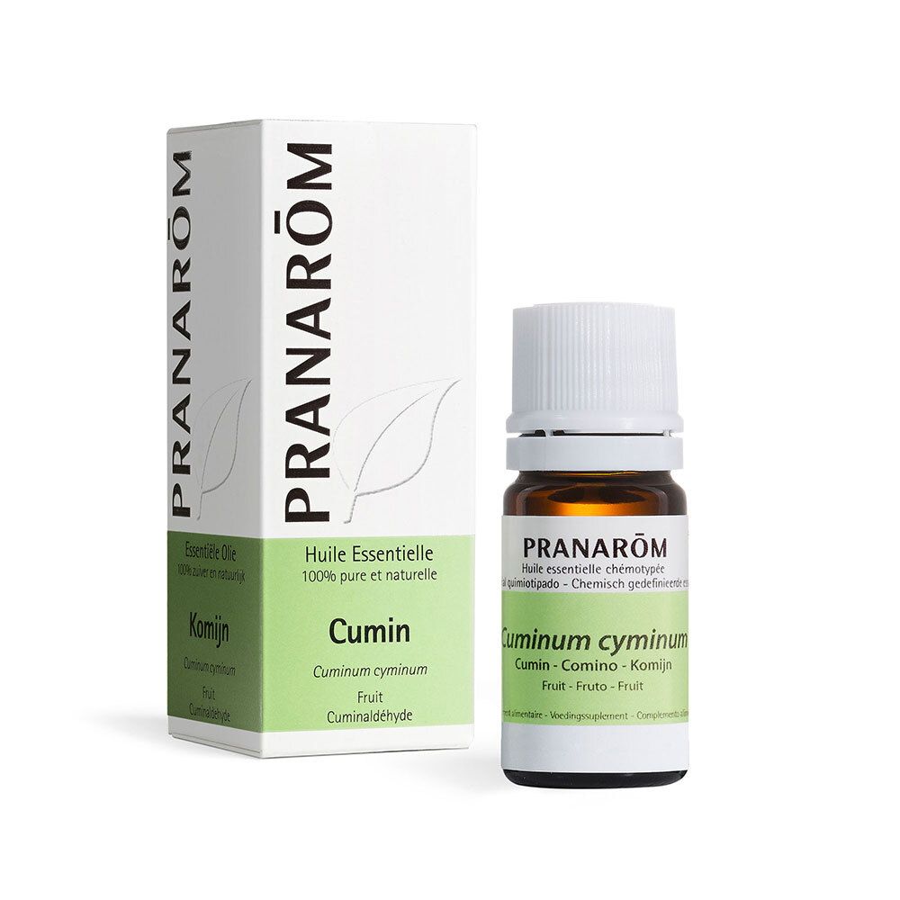 Flacon en verre et boîte PRANAROM. Contient Cuminum cymimum. Graines de cumin à côté.