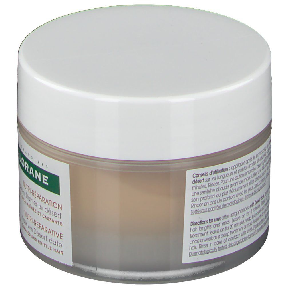 Pot de crème avec couvercle blanc. Inscription: KLORANE. Texte: Conseils d'utilisation. Testé dermatologiquement.