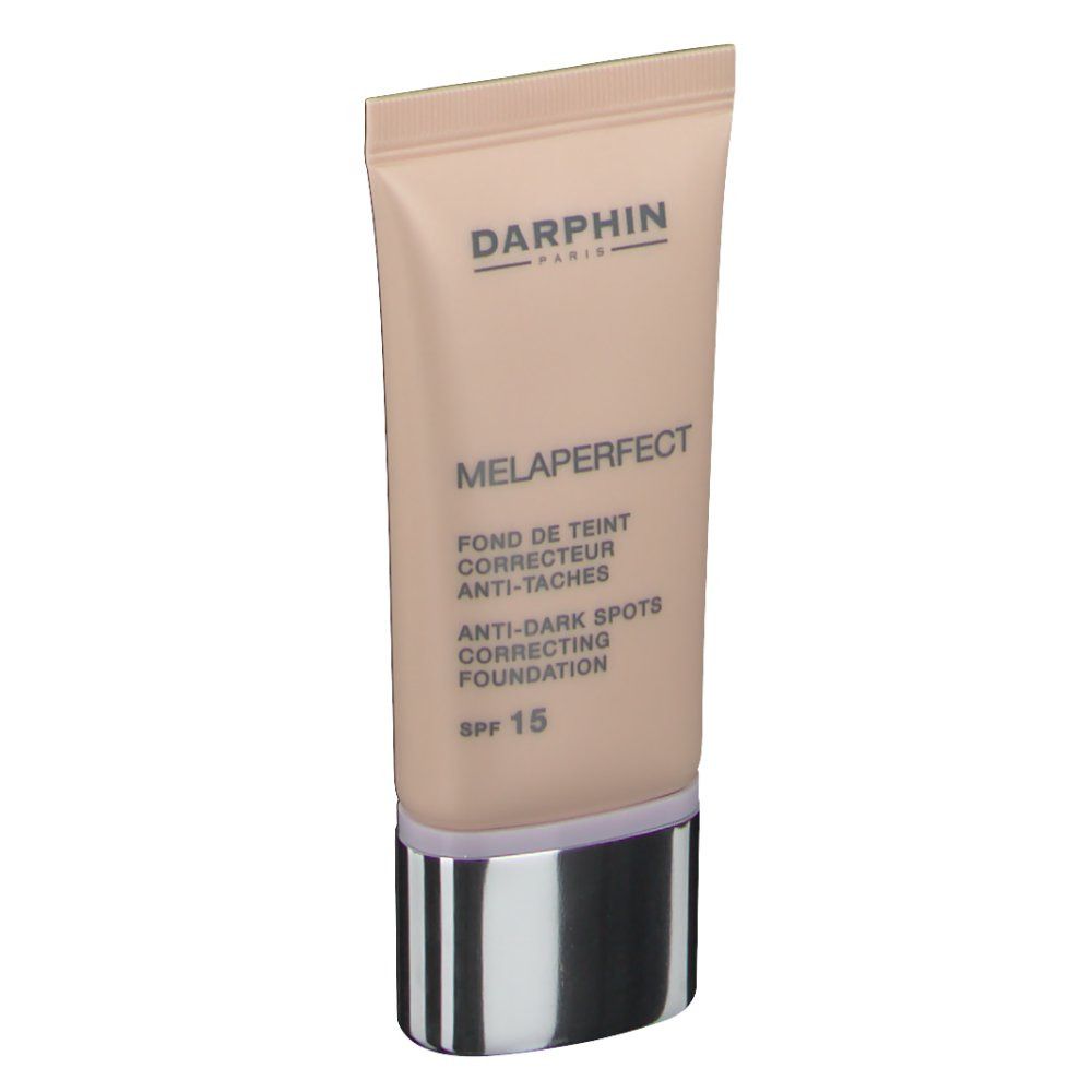 Darphin Melaperfect Fond De Teint Correcteur Ivoire SPF 15. Tube de fond de teint rose, bouchon argenté. Texte sur le tube.
