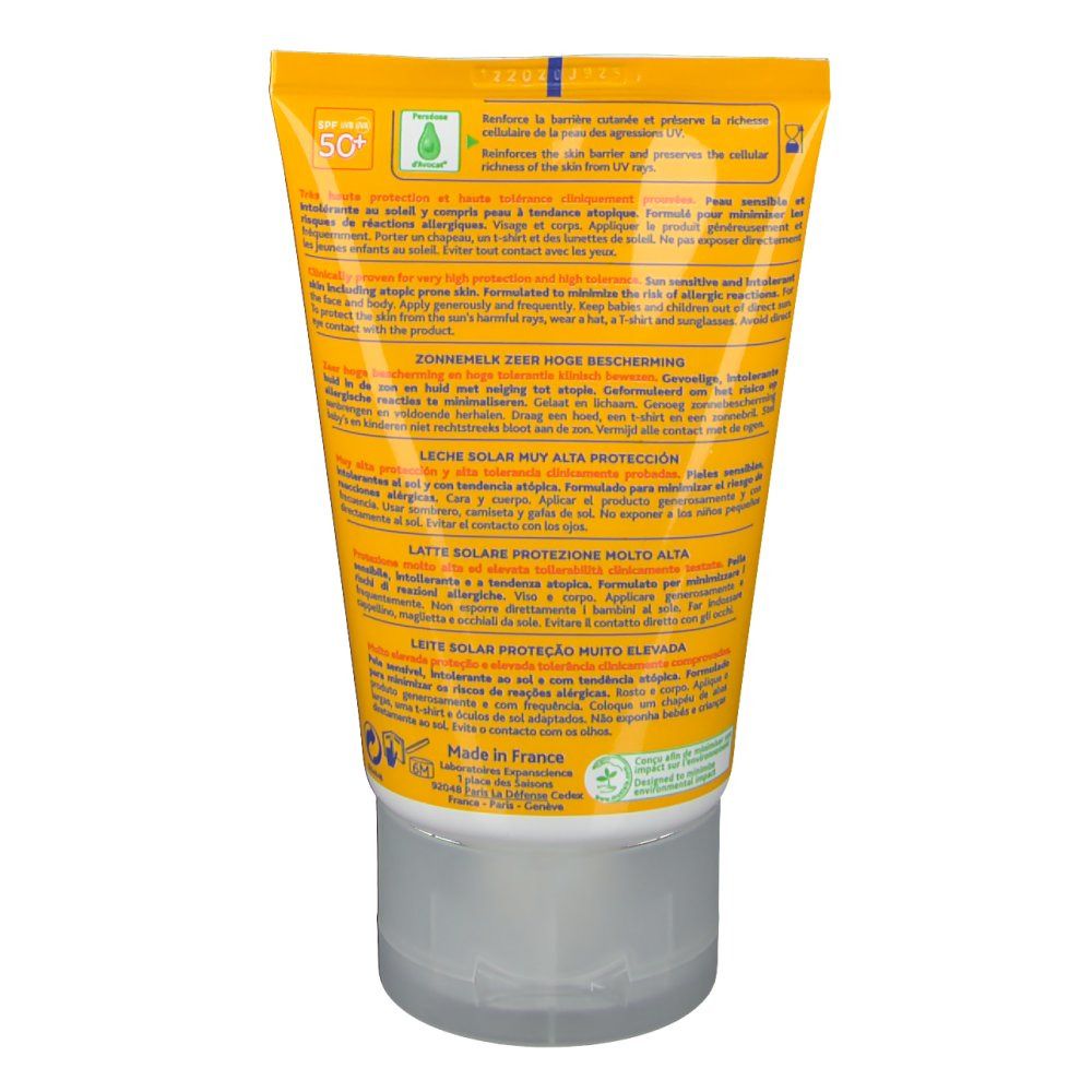 Dos du tube jaune. Textes multilingues. Principalement jaune et blanc. Contient des informations sur le produit.