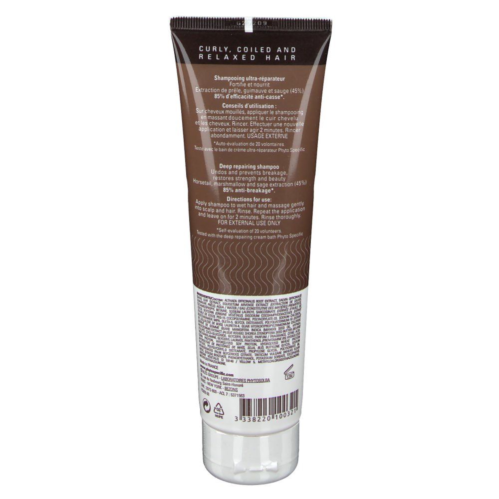 Tiefreparierendes Shampoo-Tube. Braune Tube mit Text und Wellenmuster. Aufschrift: Curly, Coiled and Relaxed Hair.