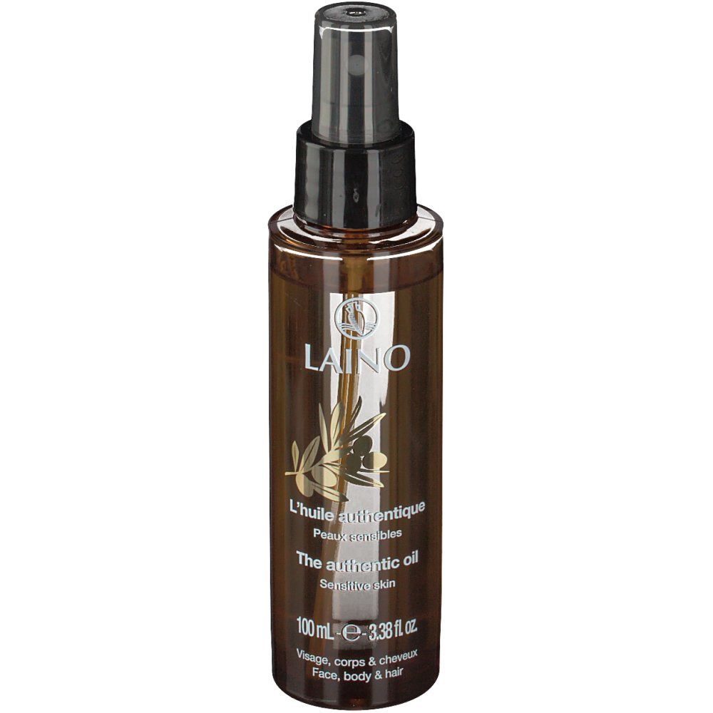 Braune Sprühflasche mit schwarzem Sprühkopf. Aufschrift: LAINO, L'huile authentique, The authentic oil, Sensitive skin.
