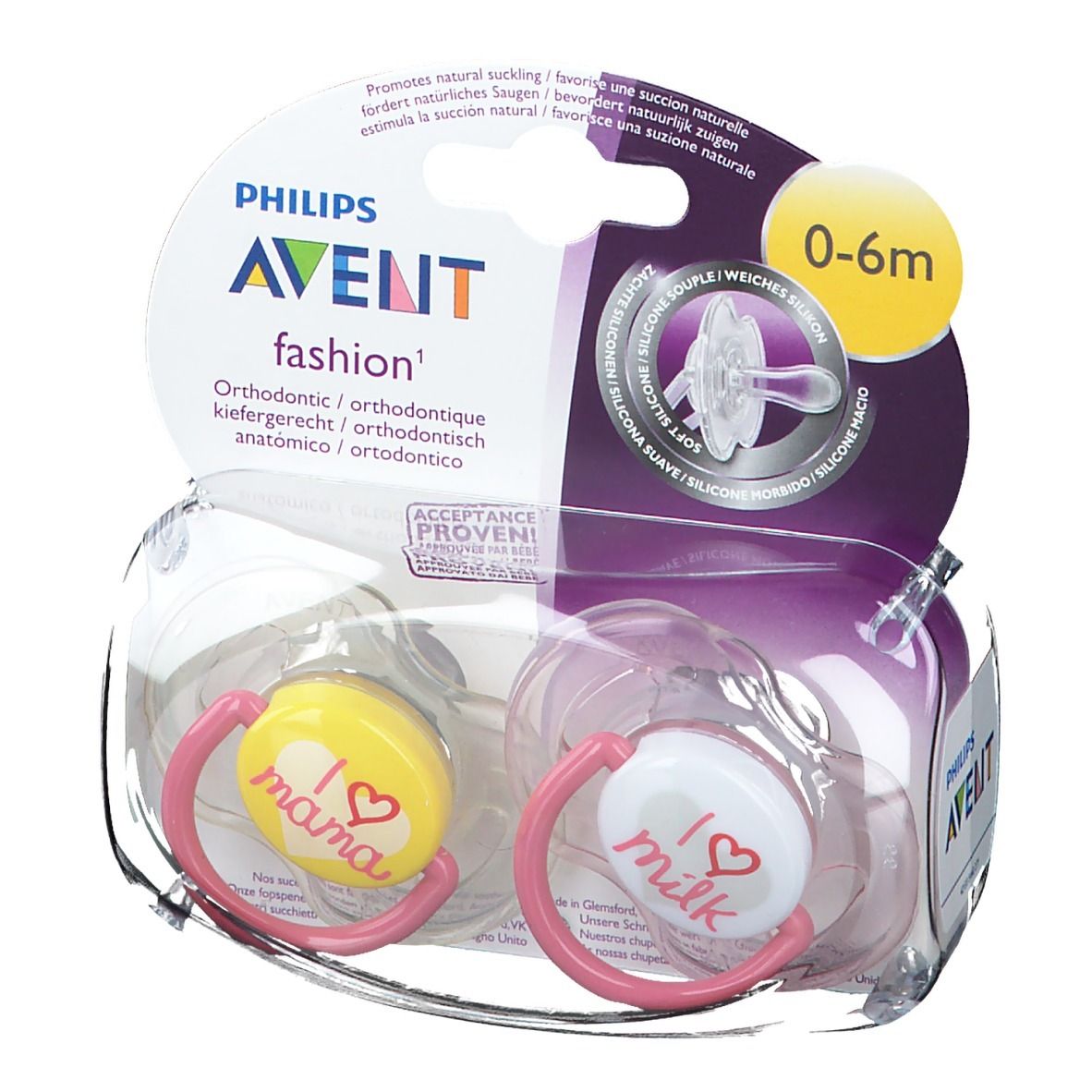 Zwei Schnuller in Verpackung. Gelber Schnuller mit "I love mama", weißer mit "I love milk". Pinke Ringe. 0-6m.
