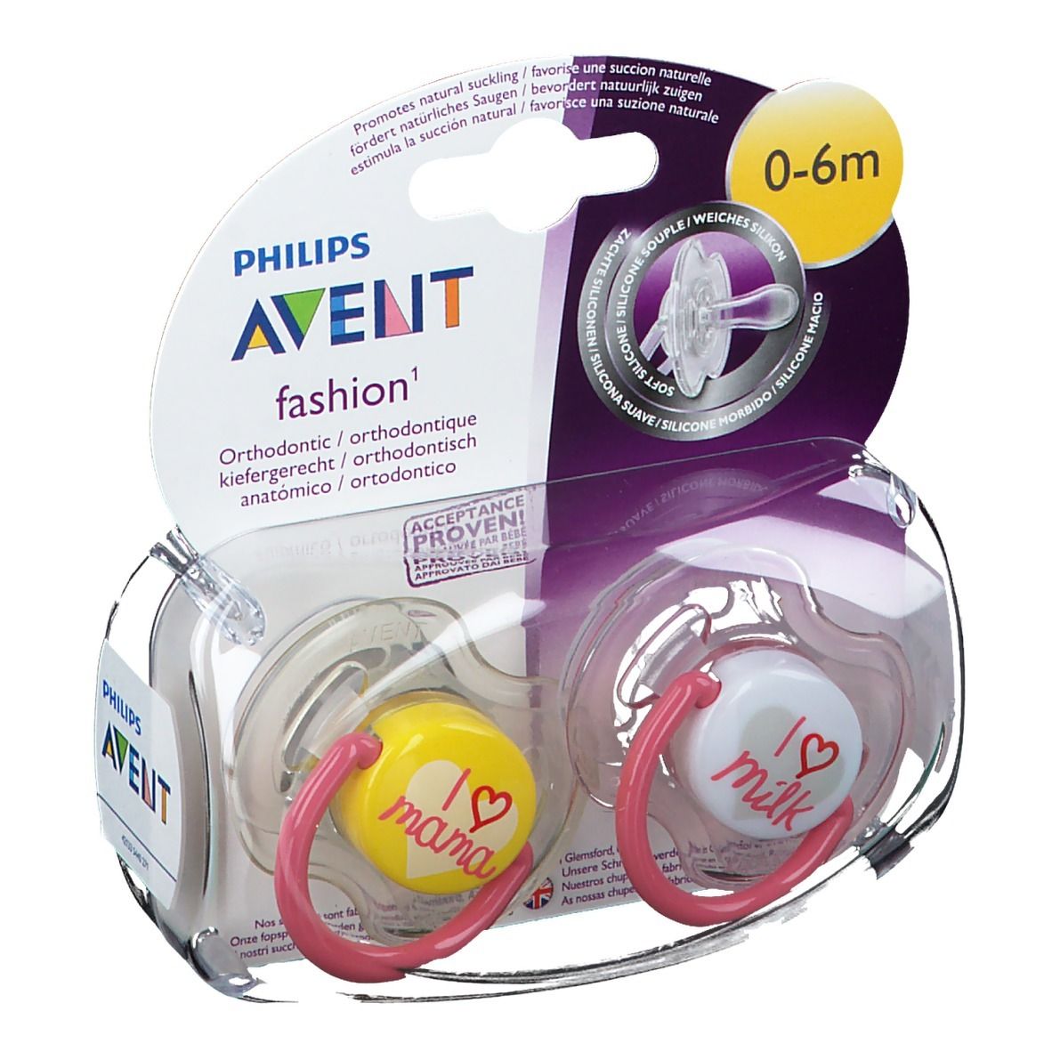 Zwei Schnuller in Verpackung. Gelber Schnuller mit "I love mama", weißer mit "I love milk". Pinke Ringe. 0-6m.