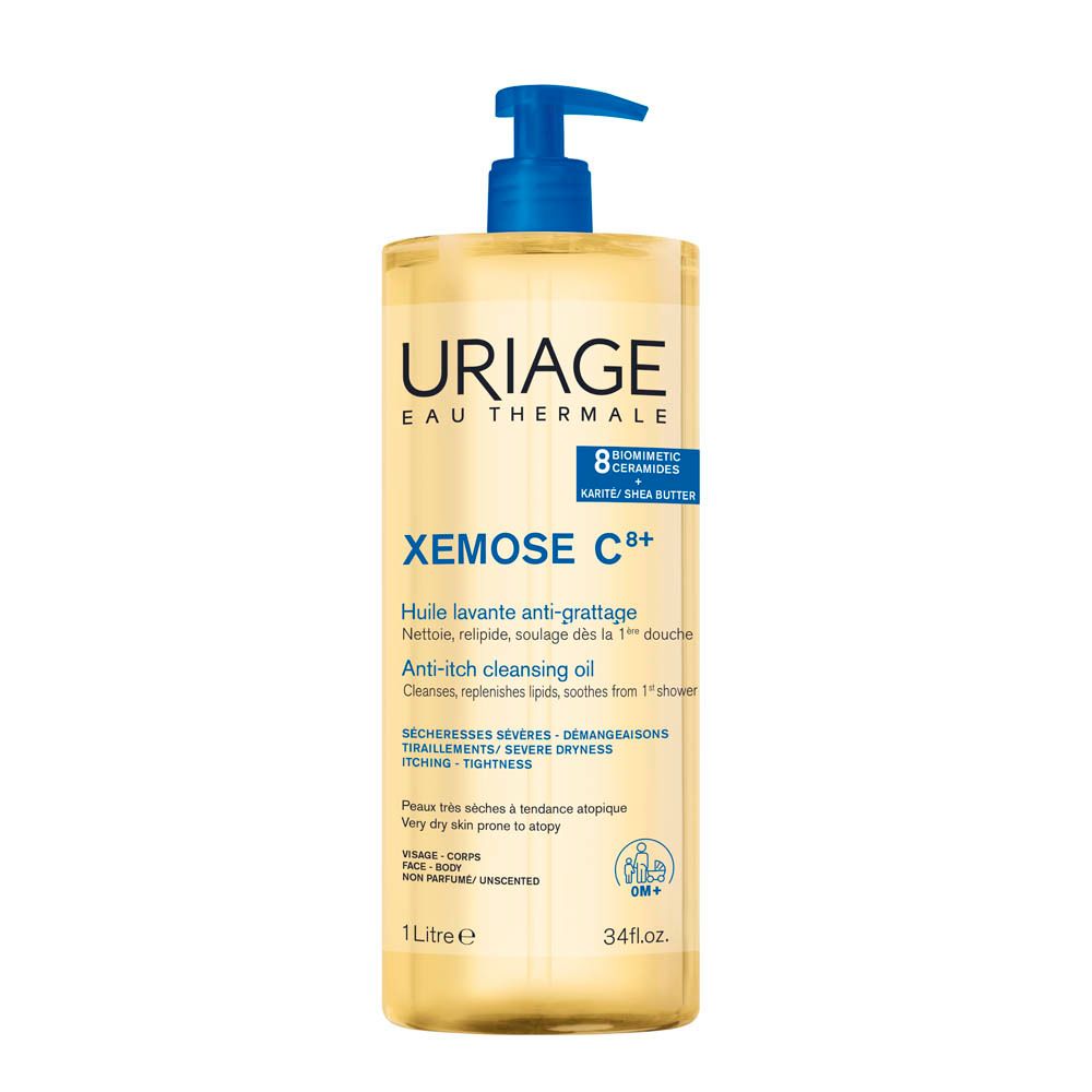 Uriage Xémose C+ Reinigungsöl. Flasche mit blauem Pumpverschluss. Etikett mit Text und Logo.