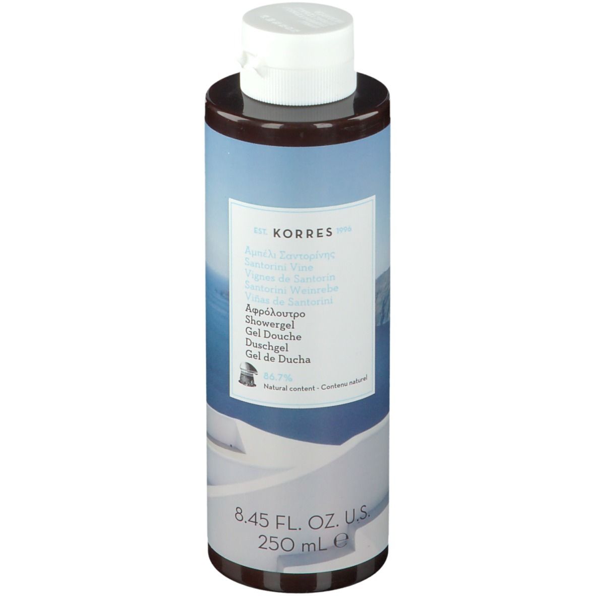 KORRES Duschgel Santorini. Zylindrische Flasche mit weißem Deckel. Etikett mit Produktnamen und Inhaltsangaben.