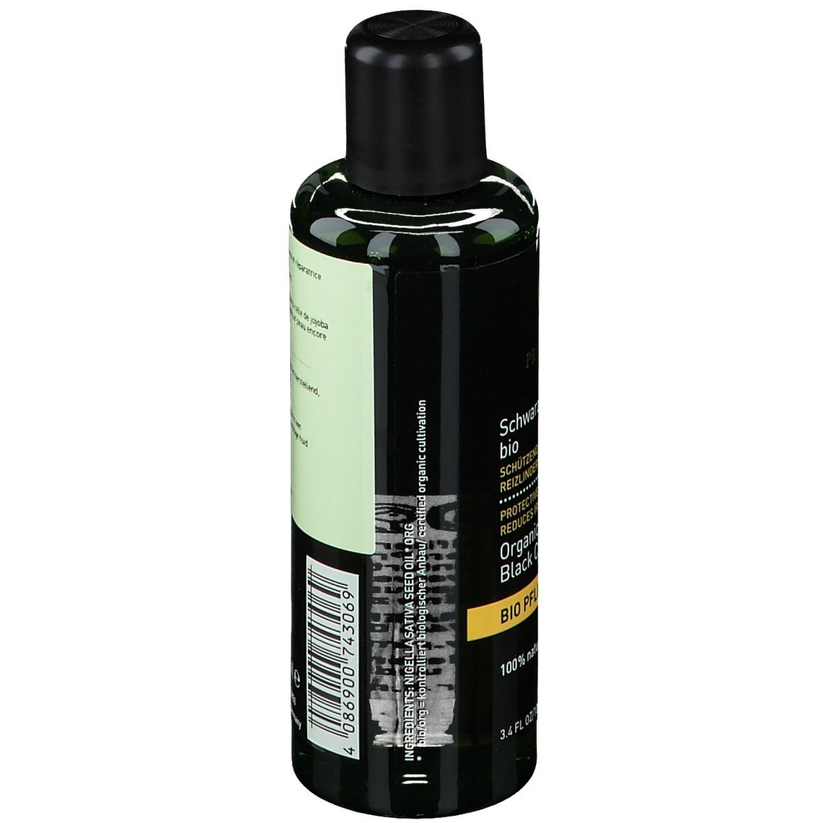 Grüne Flasche mit schwarzem Verschluss. Produktetikett mit Text: Schwarzkümmelöl bio.