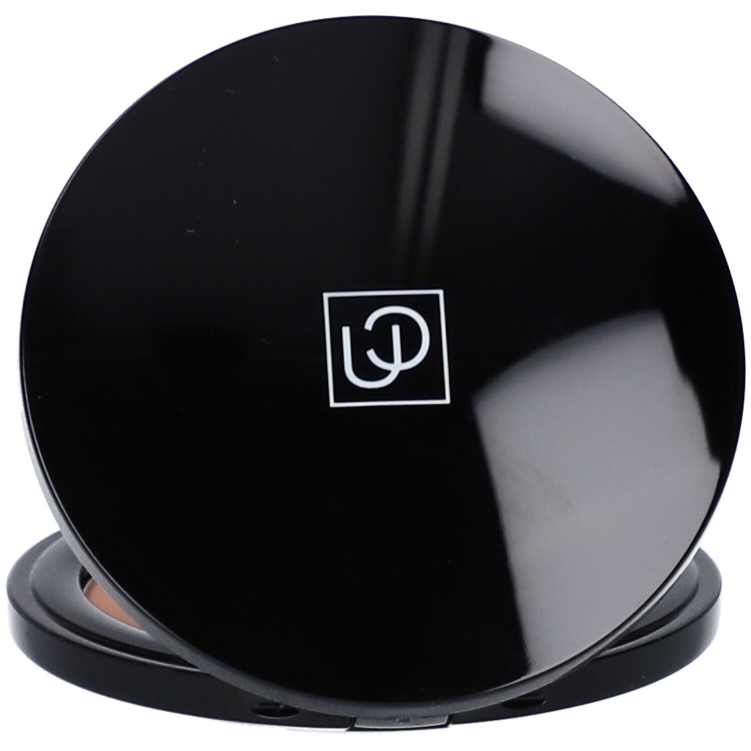 Geschlossene, runde Bronzepuder-Palette. Schwarzer Rahmen, hellbraunes Puder. Deckel mit Logo.