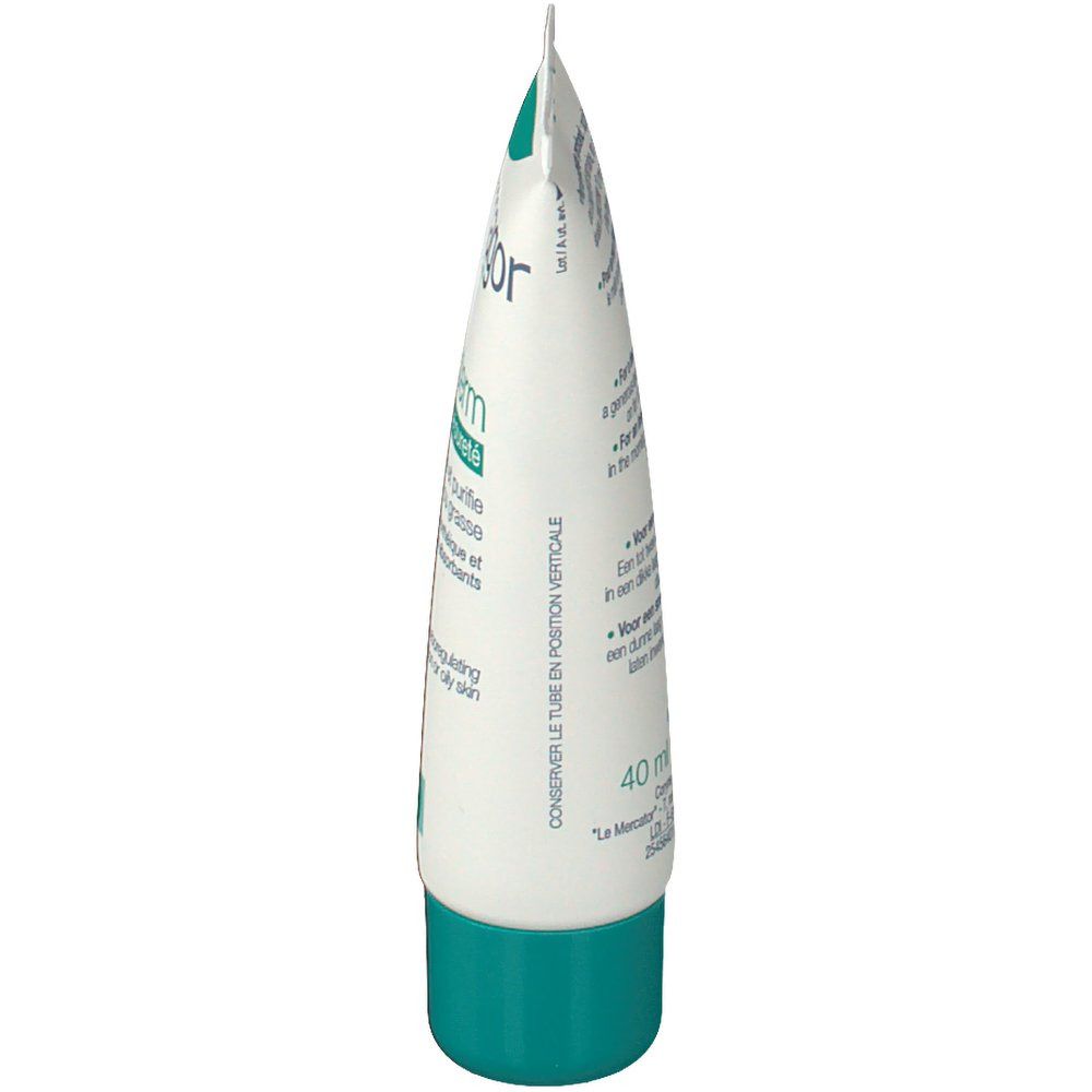 Seitenansicht des Creme-Tubes. Grün-weiße Verpackung. Text in Französisch und Englisch.