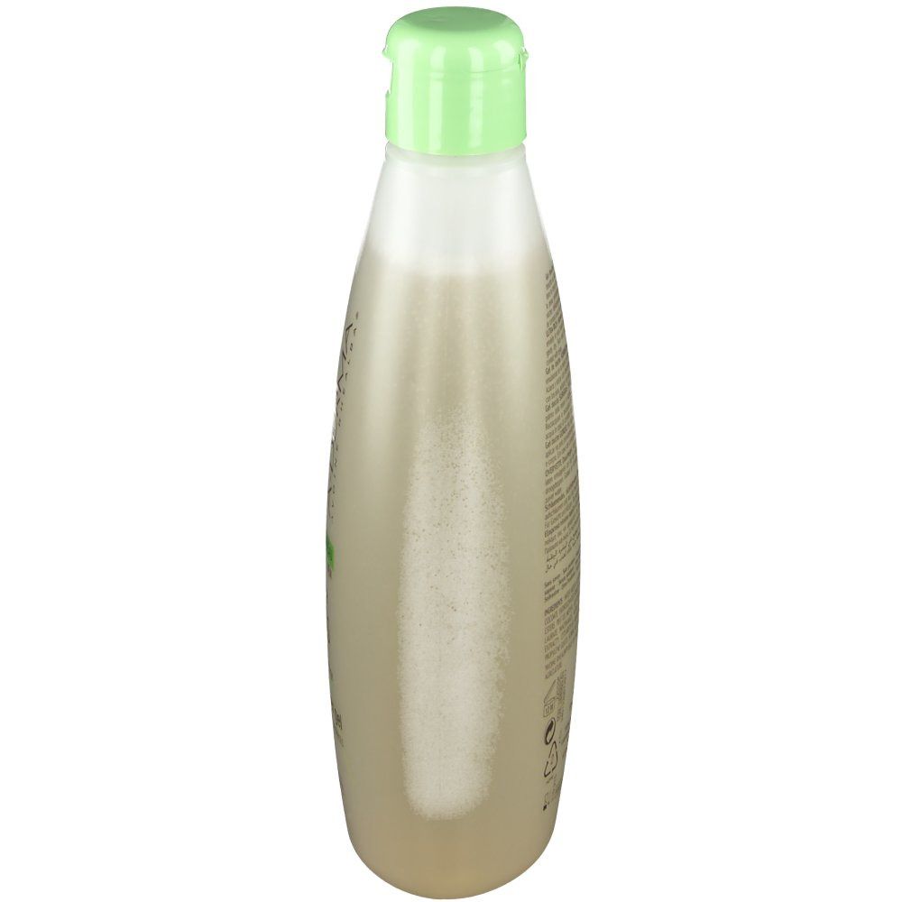 A-Derma Hafermilch Duschgel Überfett. Flasche mit grünem Deckel. Durchsichtiges, beiges Gel. Aufschrift.