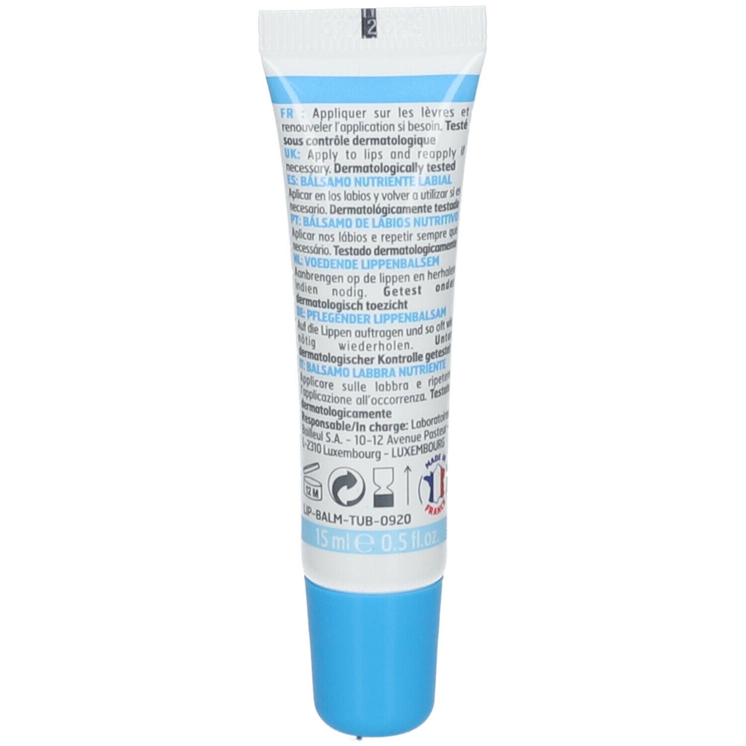 Rückseite des Lippenbalsam-Tubes. Text in mehreren Sprachen. Enthält Informationen zur Anwendung und Inhaltsstoffe. 15 ml.