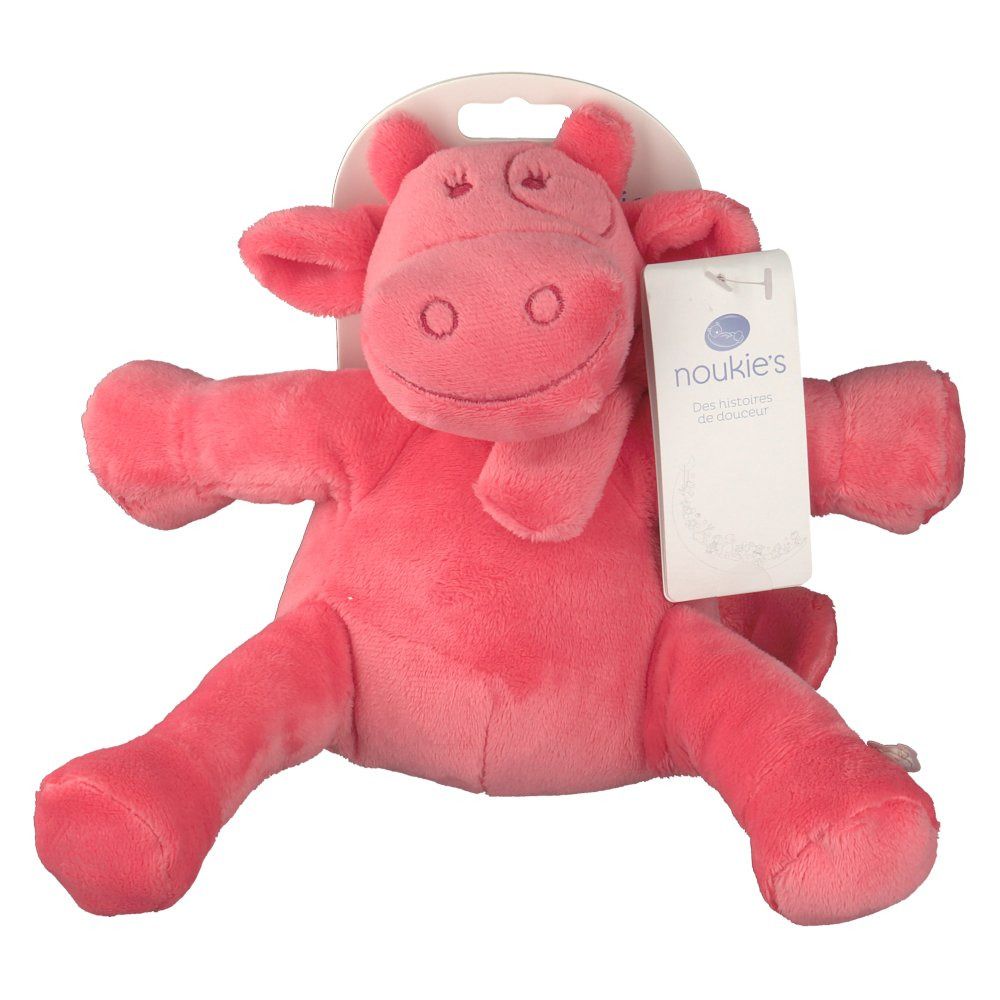 Peluche rose en forme de vache. Avec étiquette. Matière douce. Bras et jambes écartés. L'étiquette indique 'noukies'.