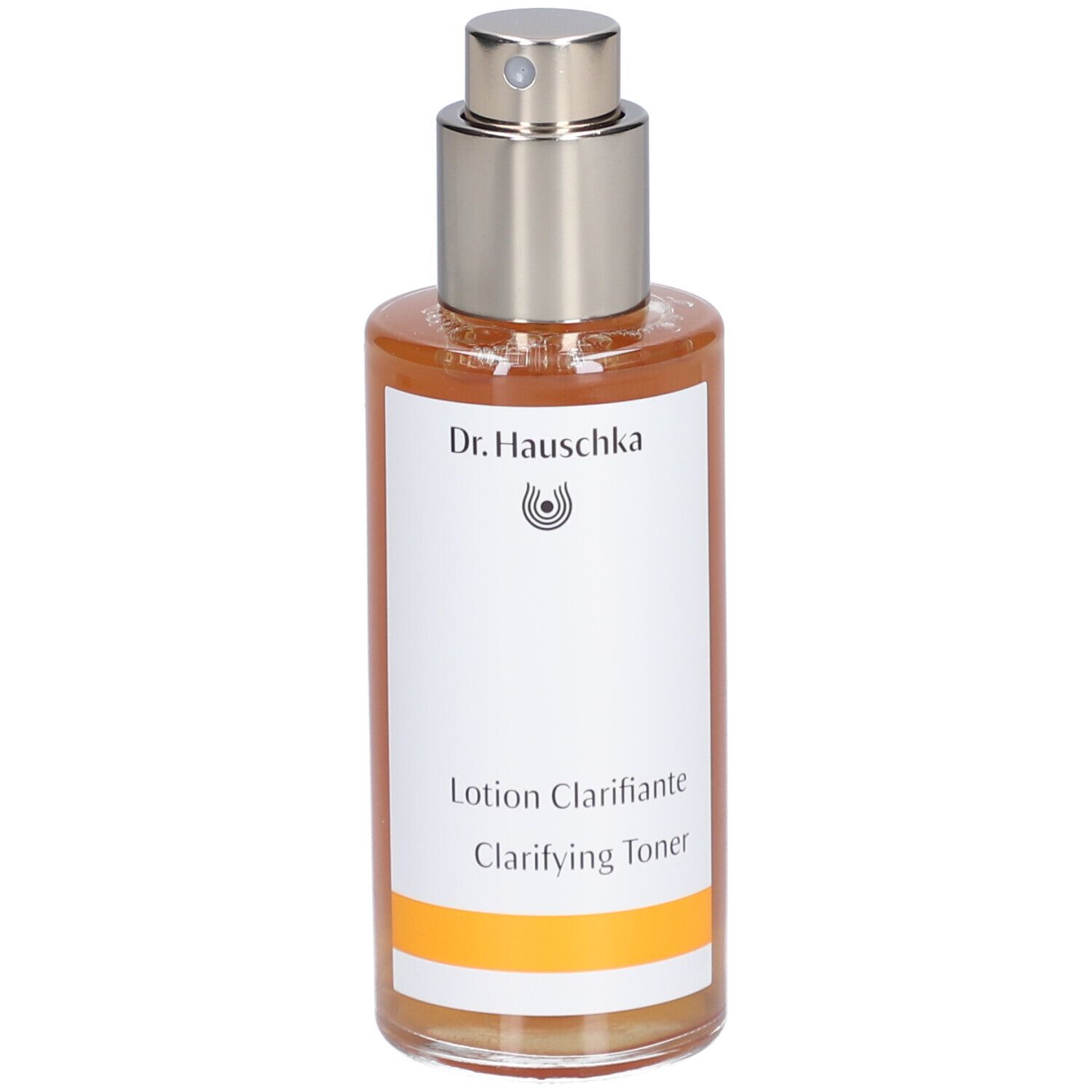Braune Flüssigkeit in einer Glasflasche mit Sprühkopf. Aufschrift: Dr. Hauschka, Lotion Clarifiante, Clarifying Toner.