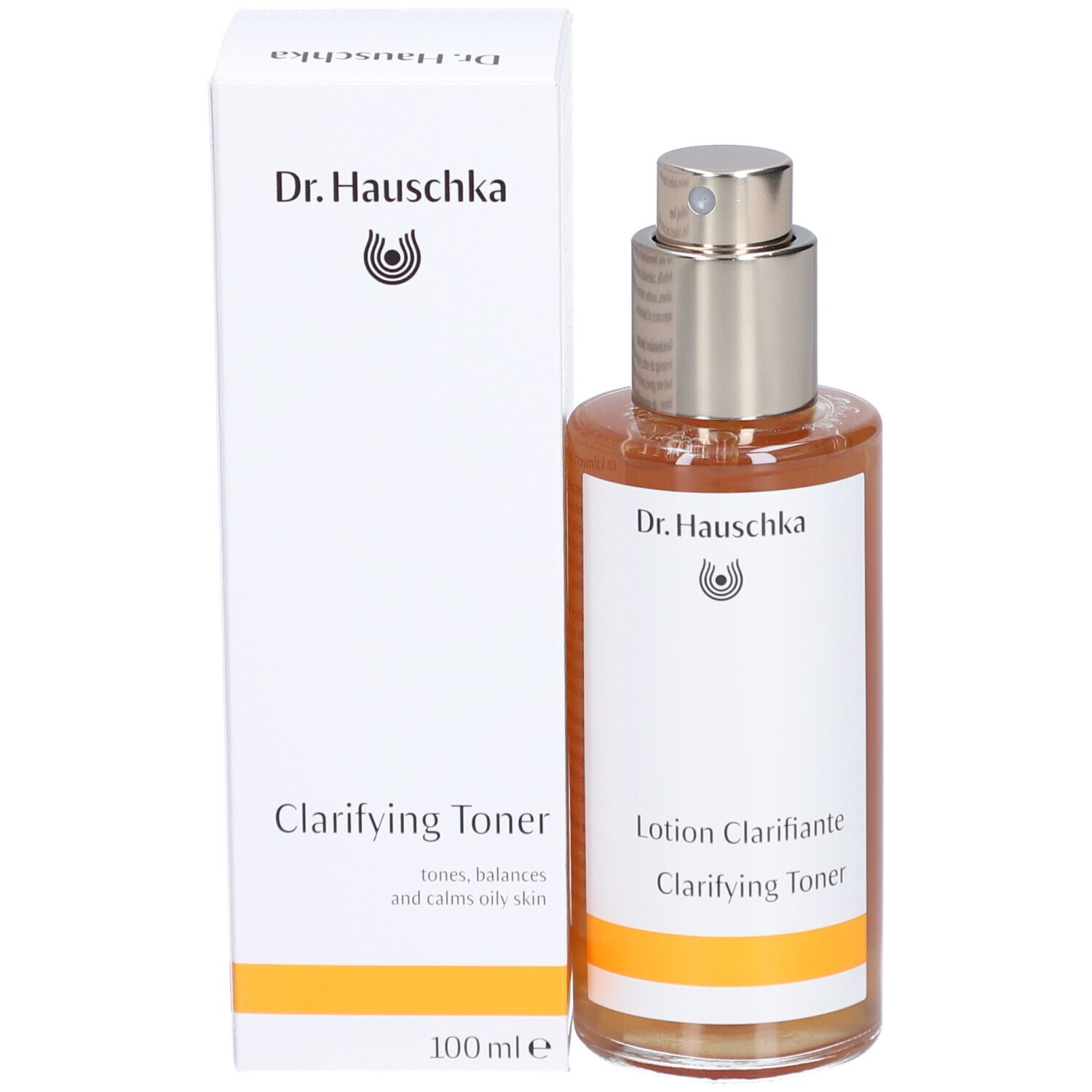 Produktflasche und Verpackung. Flasche mit brauner Flüssigkeit und Sprühkopf. Aufschrift: Dr. Hauschka, Clarifying Toner.