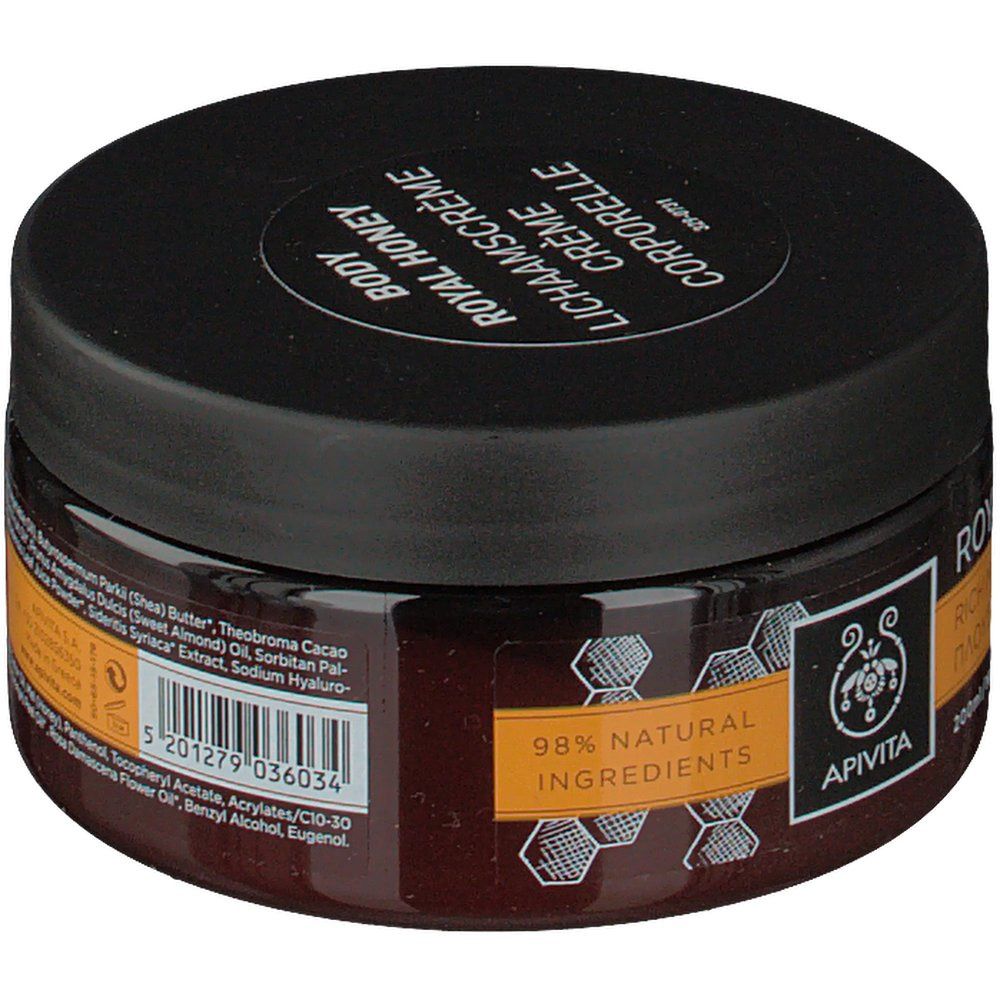 Runde Dose Apivita Body Creme Hydratante Royal Honey. Schwarzer Deckel, braunes Glas. Aufschrift: Royal Honey, 98% natürliche Inhaltsstoffe.