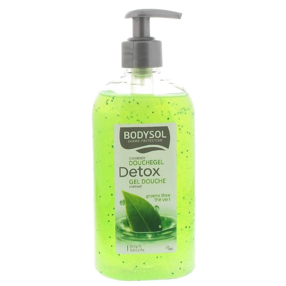 Grüne Duschgel-Flasche mit Pumpe. Aufschrift: Bodysol Detox. Enthält grüne Partikel und ein Blatt-Symbol. Produktname und Marke sichtbar.