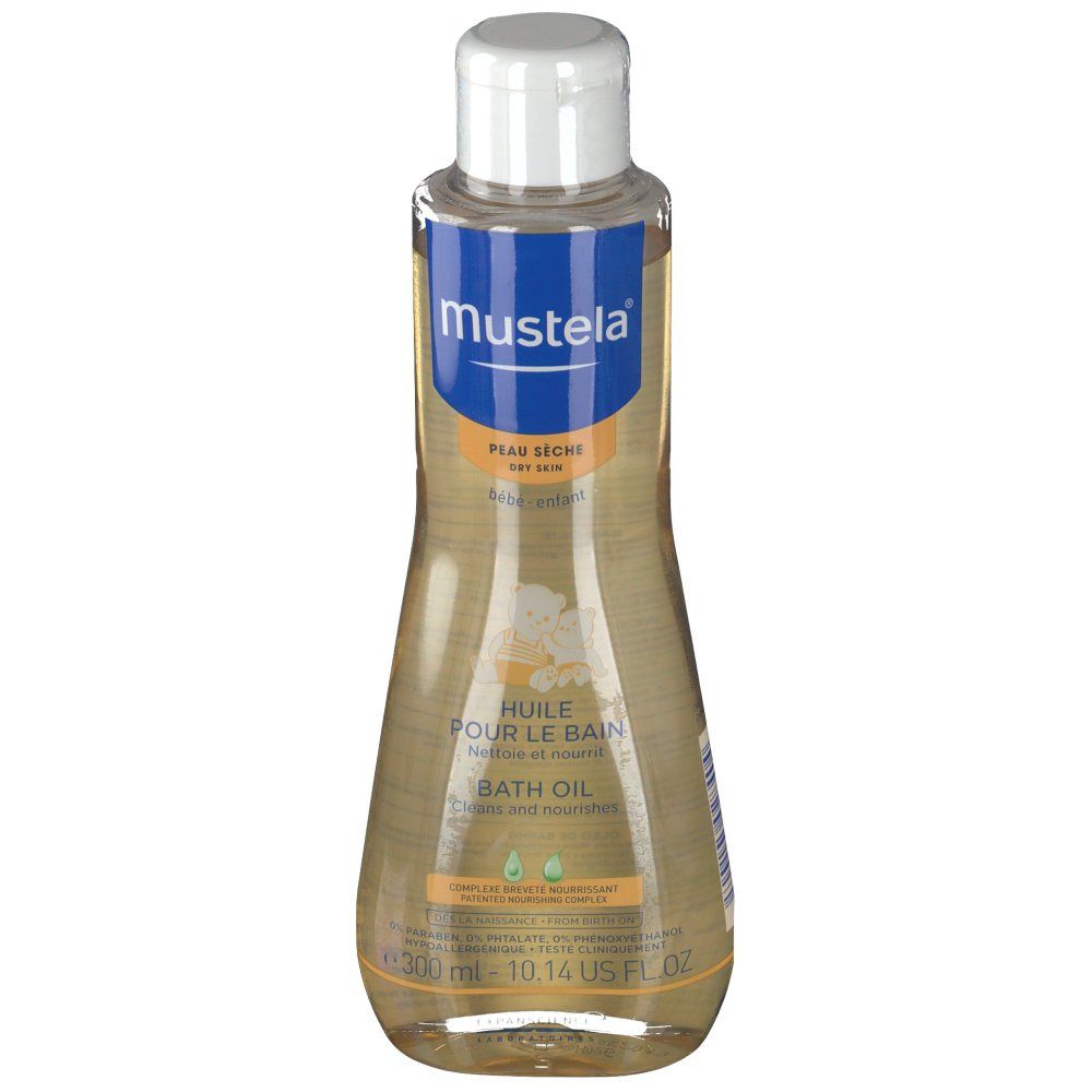 Flacon d'huile de bain Mustela. Étiquette bleue et blanche avec nom et texte du produit. Liquide transparent. Bouchon blanc.