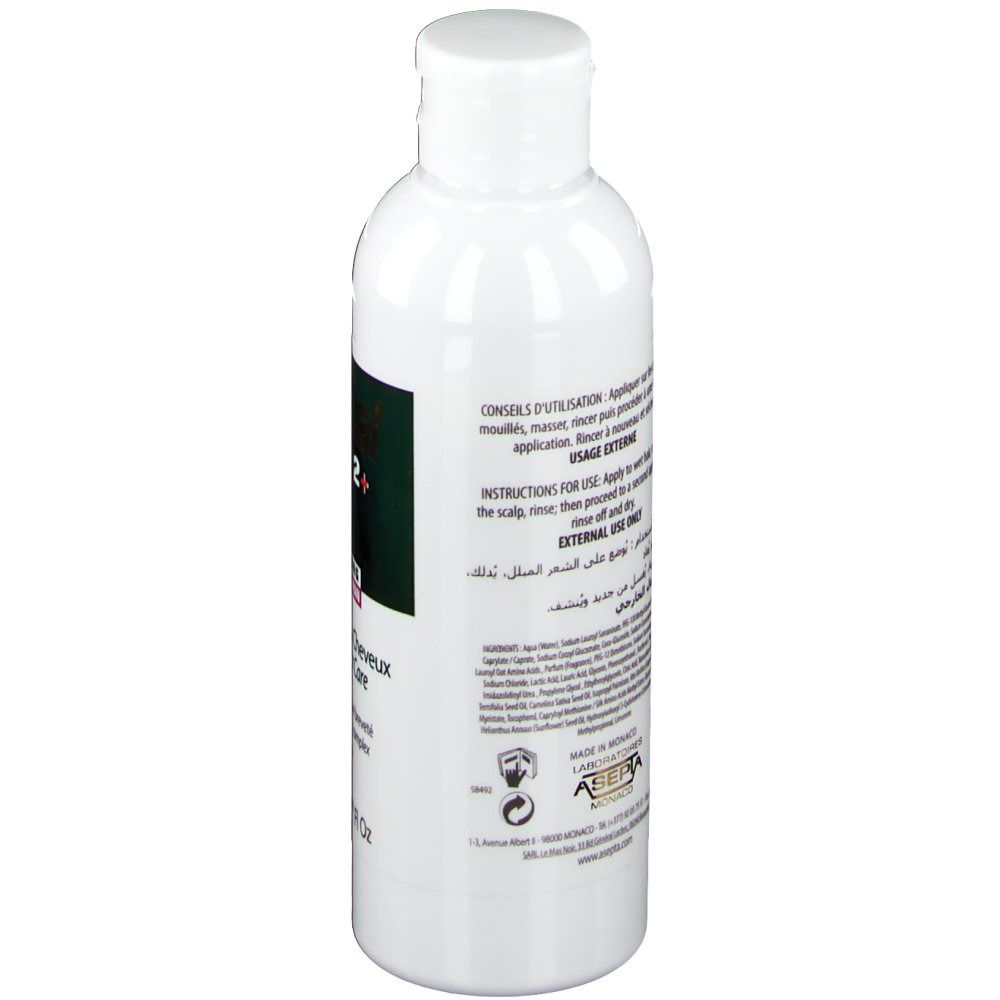 Ecrinal ANP 2+ Shampoo Frau. Rückseite der weißen Flasche. Text und Informationen zur Anwendung.