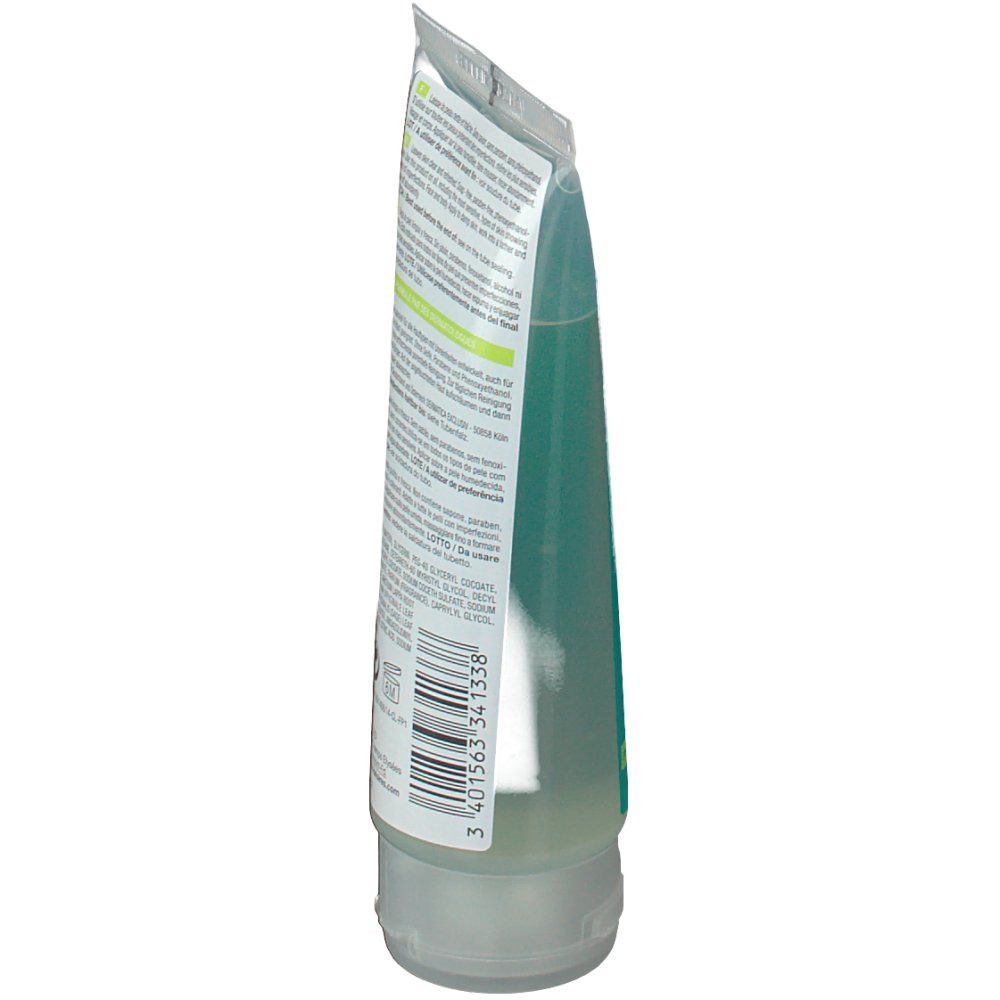 Seitenansicht der Rückseite einer Tube mit grünem Gel. Text in mehreren Sprachen. Barcode sichtbar.