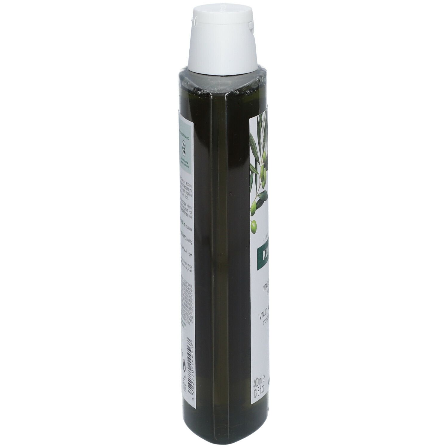 Schmale Ansicht einer grünen Shampoo-Flasche mit weißem Deckel. Etikett mit Text und Oliven-Illustration.