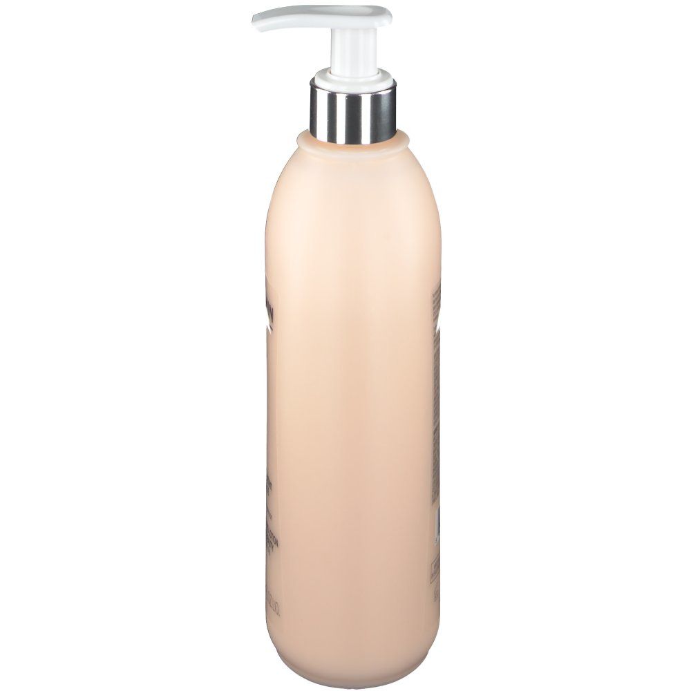 Flacon beige avec pompe, vue latérale. Tête de pompe argentée.