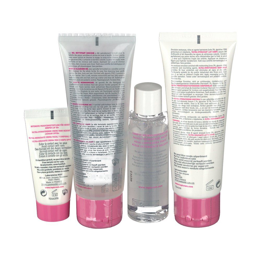 Rückansicht von vier Kosmetikprodukten. Weiße Tuben mit rosa Akzenten. Text und Produktinformationen sind sichtbar.