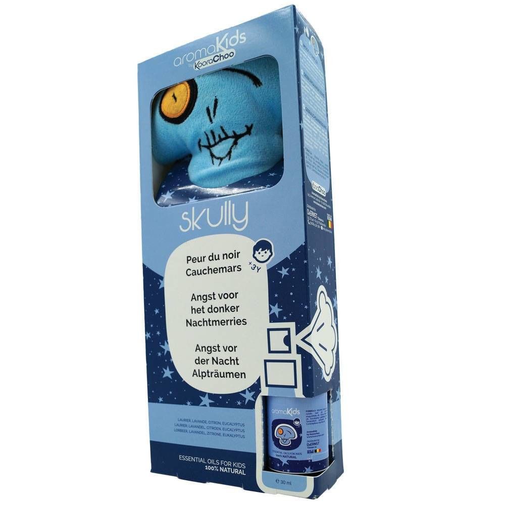 Peluche bleue en boîte. Tête de mort imprimée avec un œil jaune. Emballage avec nom du produit et textes multilingues.