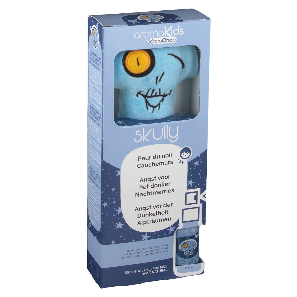Emballage du produit avec peluche bleue en forme de tête de mort. Tête de mort imprimée avec un œil jaune. Nom du produit et textes multilingues.