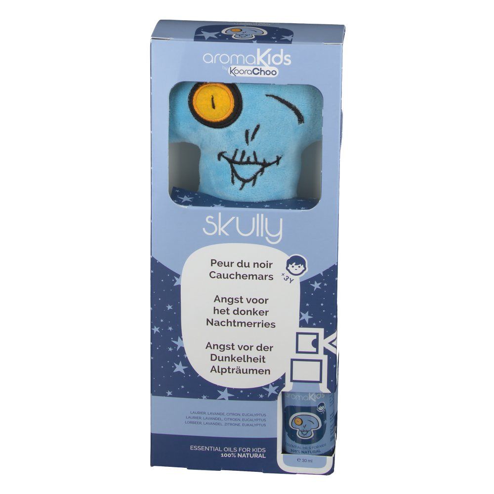 Emballage du produit avec peluche bleue en forme de tête de mort. Tête de mort imprimée avec un œil jaune. Nom du produit et textes multilingues.