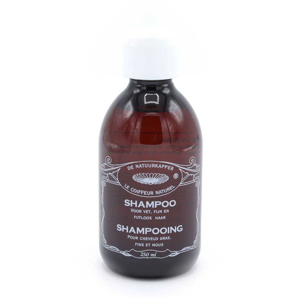 Flacon de shampooing brun avec bouchon blanc. Inscription: Shampooing pour cheveux gras, fins et mous. Marque: De Natuurkapper.