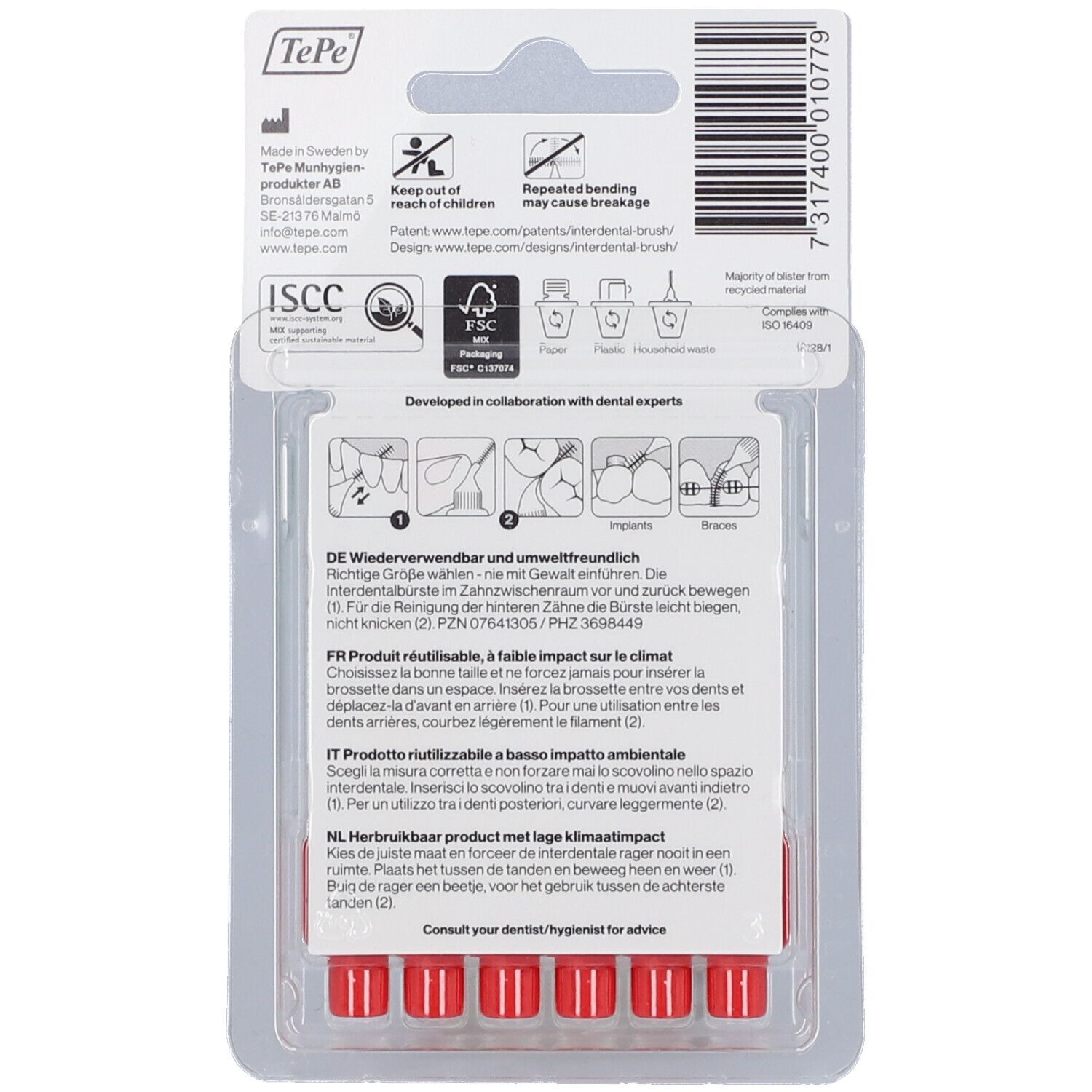 Rückseite der Verpackung mit roten Interdentalbürsten. Informationen zu Hersteller, Recycling und Gebrauchsanweisung in mehreren Sprachen.