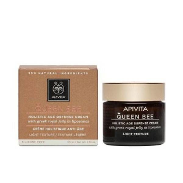 Creme und Verpackung. Aufschrift: Apivita Queen Bee, Holistic Age Defense Cream. Braune Glasdose mit goldenem Deckel.