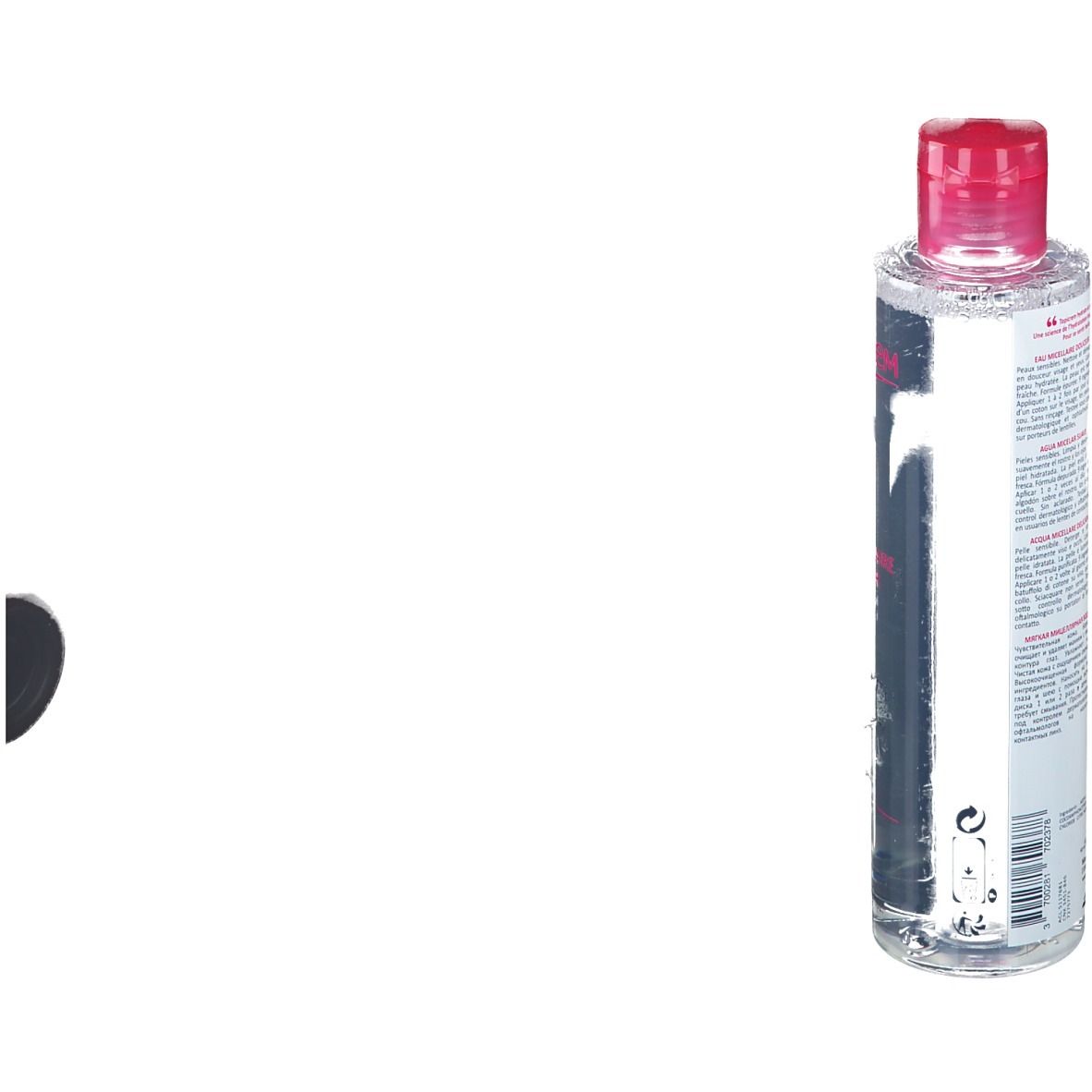 Zylindrische Flasche mit rosa Deckel. Aufschrift auf der Rückseite. Etikett mit Produktinformationen.