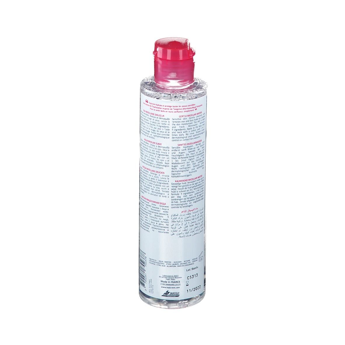 Rückansicht einer zylindrischen Flasche mit rosa Deckel. Etikett mit Produktinformationen und Chargennummer.