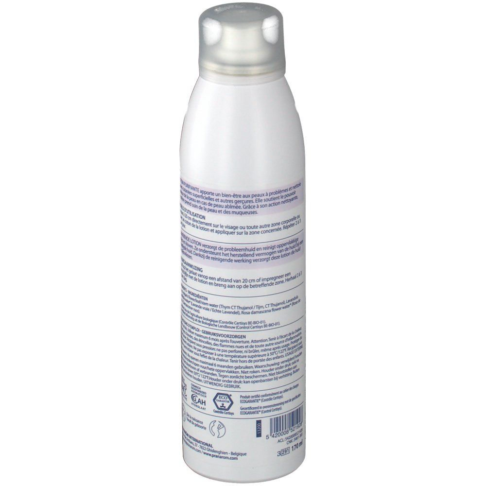 Weiße Flasche mit silbernem Deckel. Rückseite mit Text in mehreren Sprachen. Barcode und weitere Informationen.