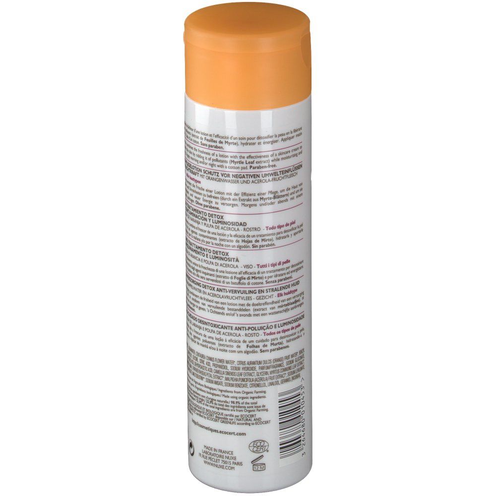Weiße Flasche mit orangefarbenem Deckel. Rückseite mit Text in verschiedenen Sprachen. Detox Lotion. Für alle Hauttypen.