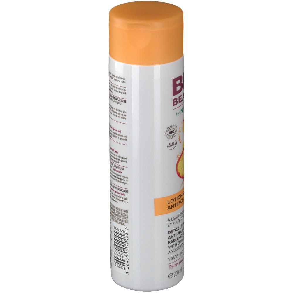 Weiße Flasche mit orangefarbenem Deckel. Aufschrift: BIO BEAUTÉ by NUXE. Detox Lotion. Mit Orangenwasser und Acerola-Fruchtfleisch.