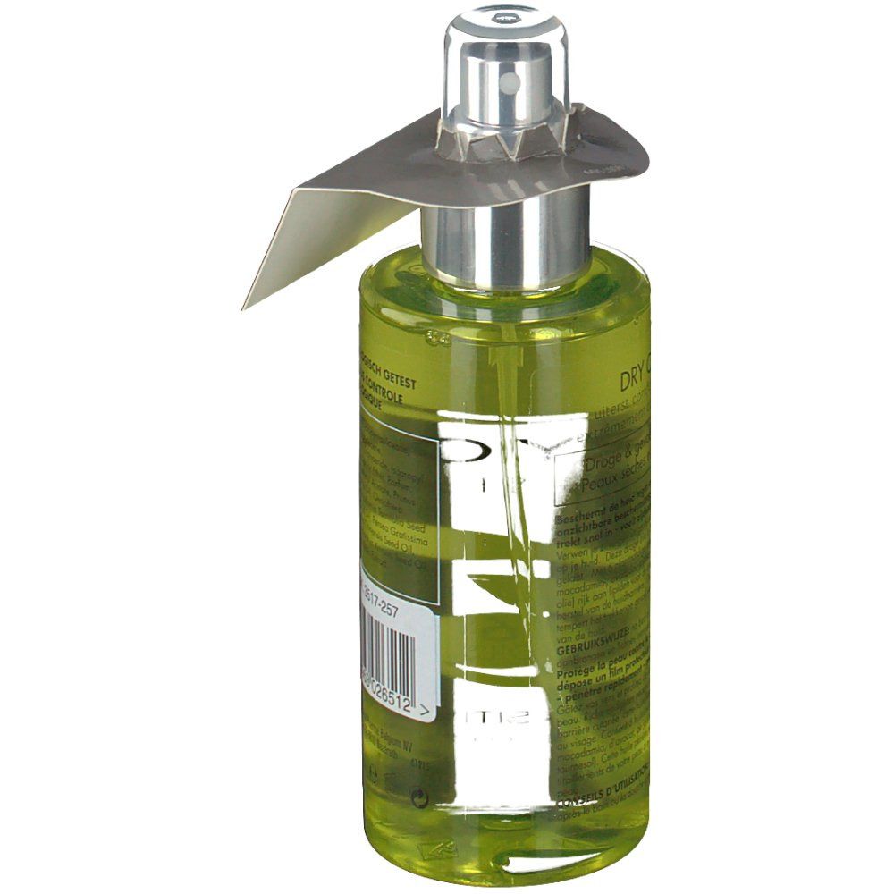 Flacon en verre vert avec vaporisateur. Étiquette avec texte et code-barres. Étiquette "-3€".