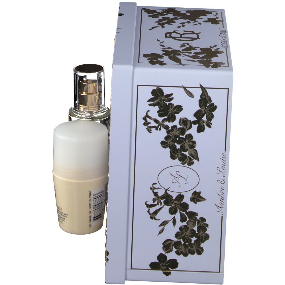 Geschenkset mit Flakon und Deodorant neben einer weißen Schachtel. Die Schachtel hat goldene Blumenmuster und den Markennamen.