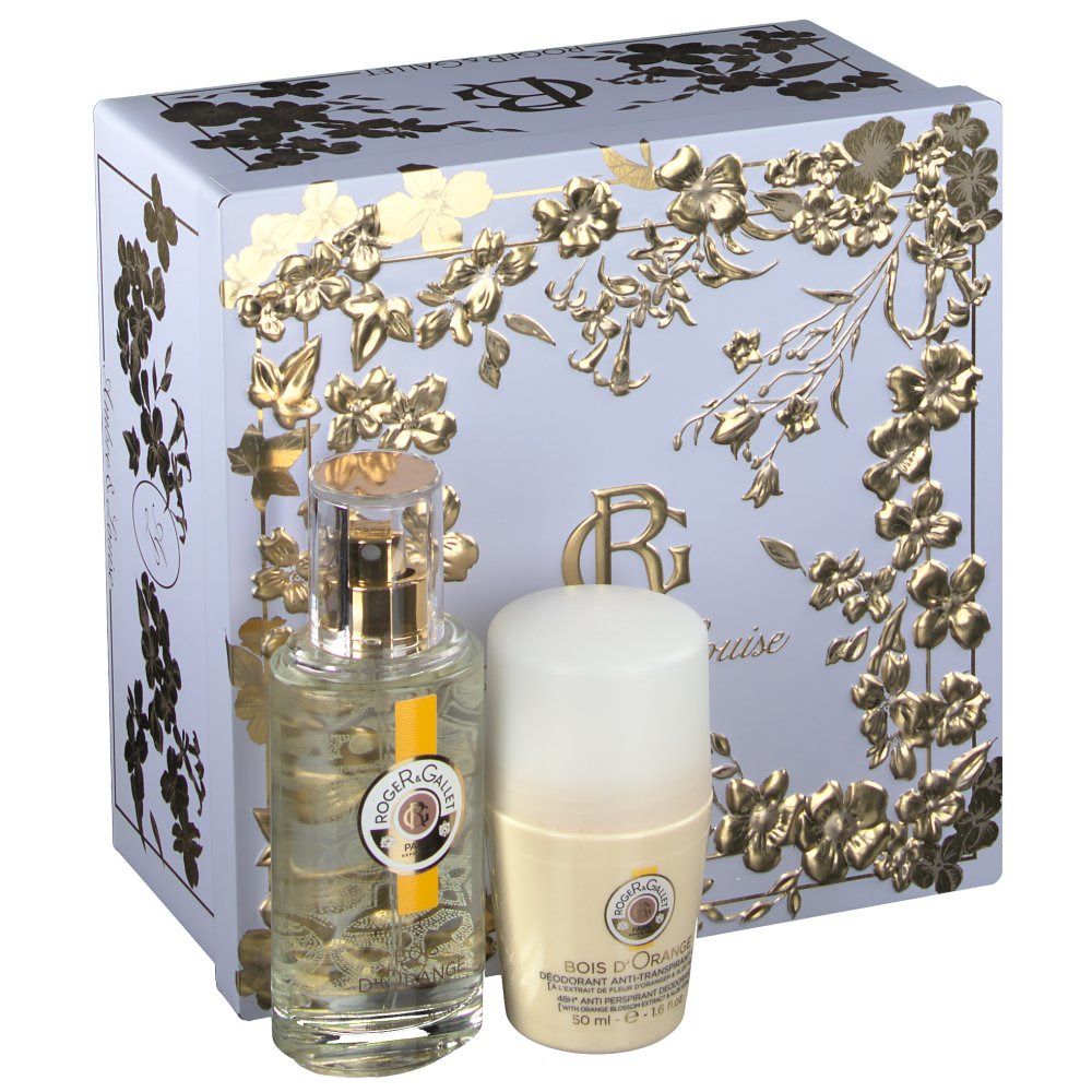 Geschenkset mit Flakon, Deodorant und Schachtel. Flakon und Deodorant stehen vor einer hellblauen Schachtel mit goldenen Blumenmustern.