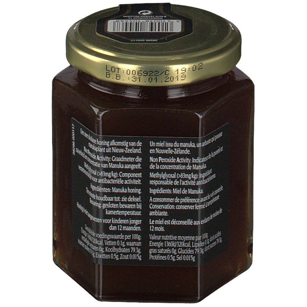 Pot de miel hexagonal avec texte sur étiquette noire et couvercle doré. Code-barres sur le couvercle.