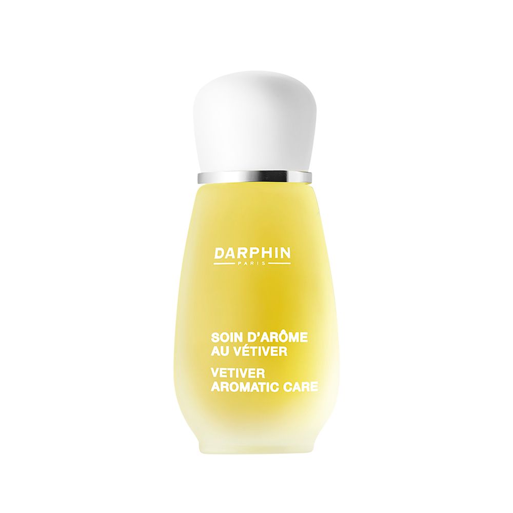 Flacon jaune avec bouchon blanc. Inscriptions: DARPHIN, Soin d'Arôme au Vétiver, Vetiver Aromatic Care.