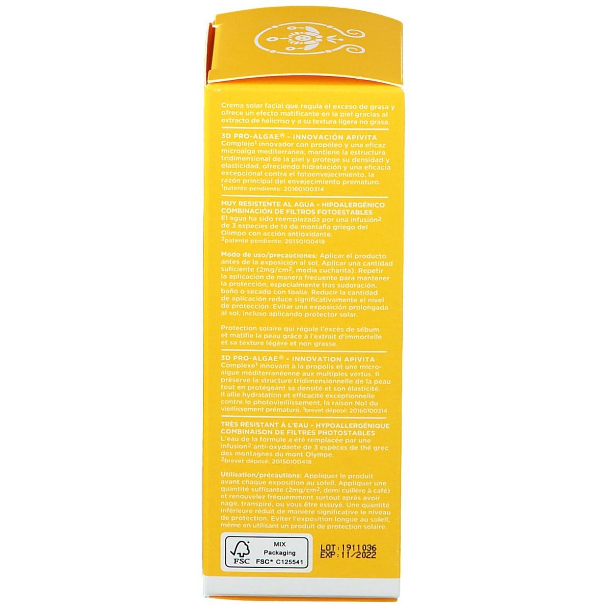 Rückseite einer gelben Sonnencreme-Schachtel. Text mit Produktinformationen und Inhaltsstoffen.