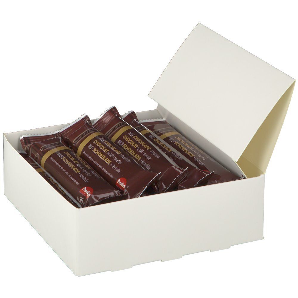 Geöffnete weiße Schachtel mit mehreren Schokoriegeln in brauner Verpackung. Marke: Prodia.