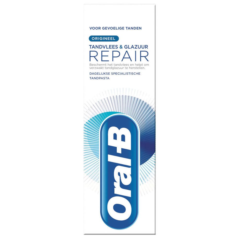 Tube de dentifrice Oral-B. Inscription: TANDVLEES & GLAZUUR REPAIR. Emballage bleu et blanc.